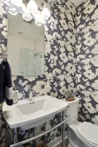 Powder room with blue and white wallpaper